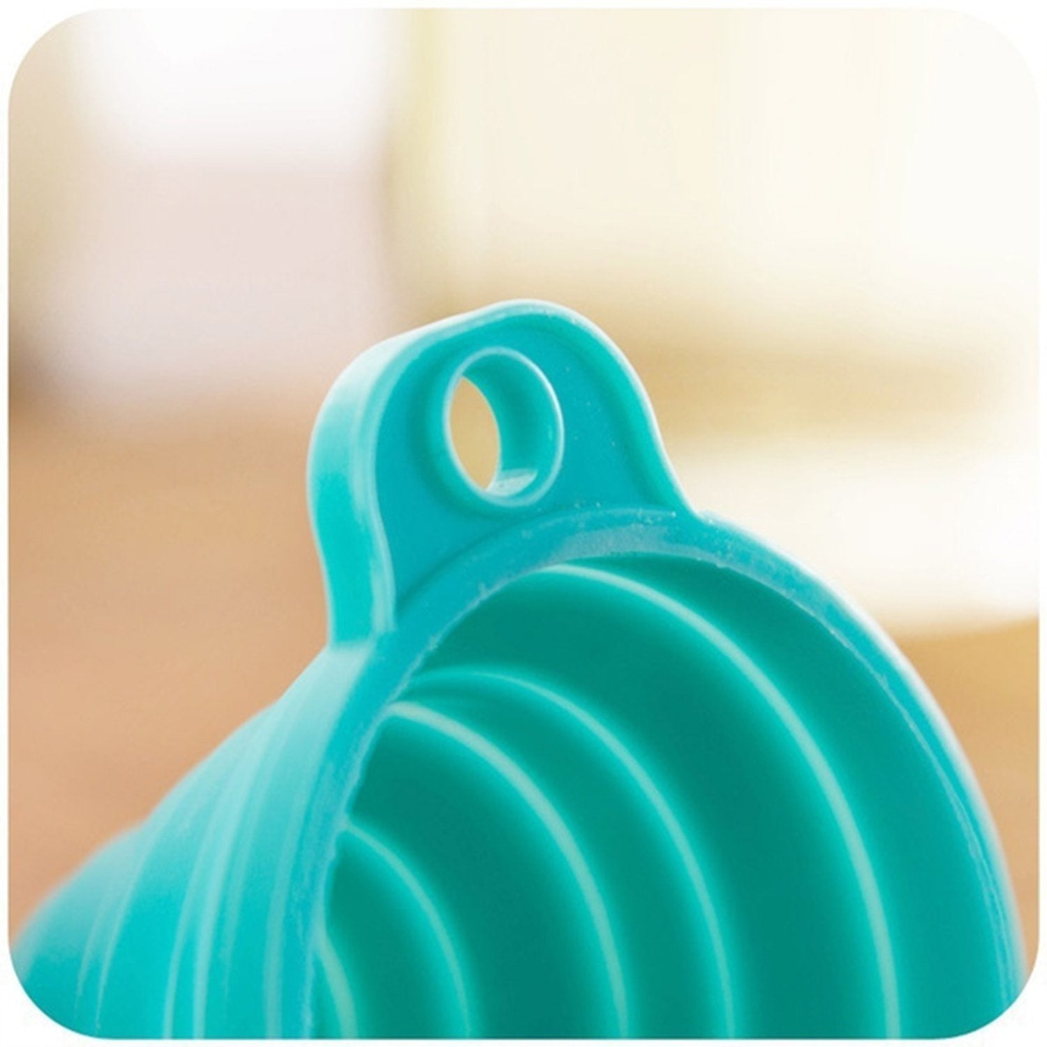 Close-up of silicone funnel for pouring. Close-up of silicone funnel for pouring.